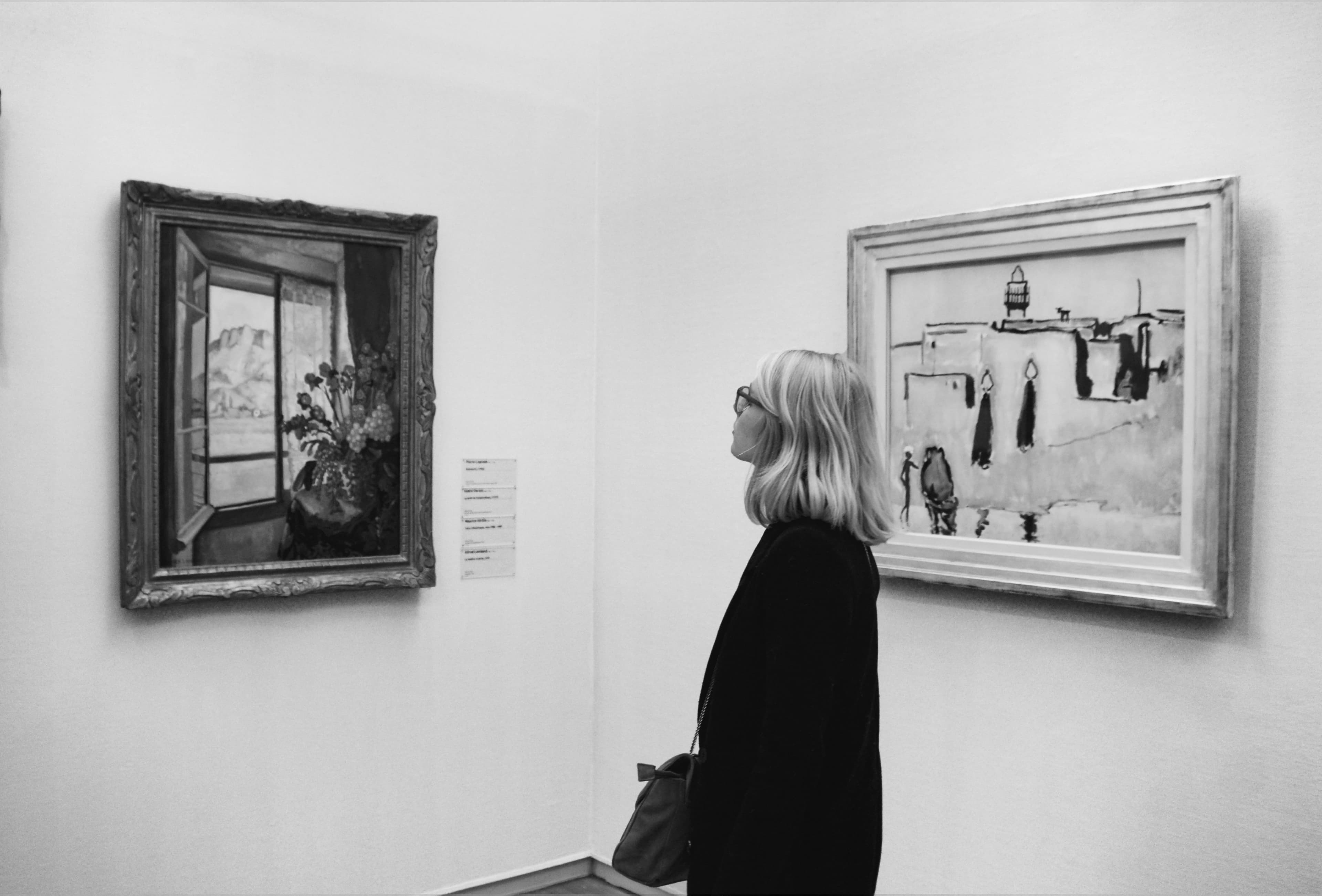 Person viewing artwork in gallery